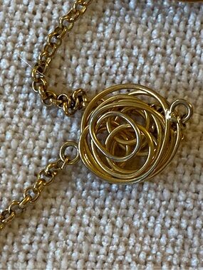 Fancy fun gold tone necklace with circle mazes.